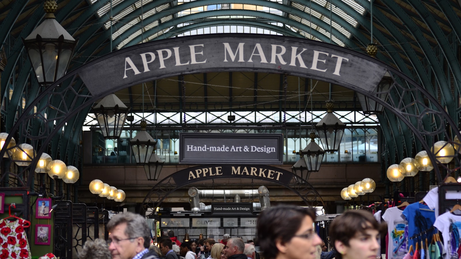 A market hall with an Apple Market sign