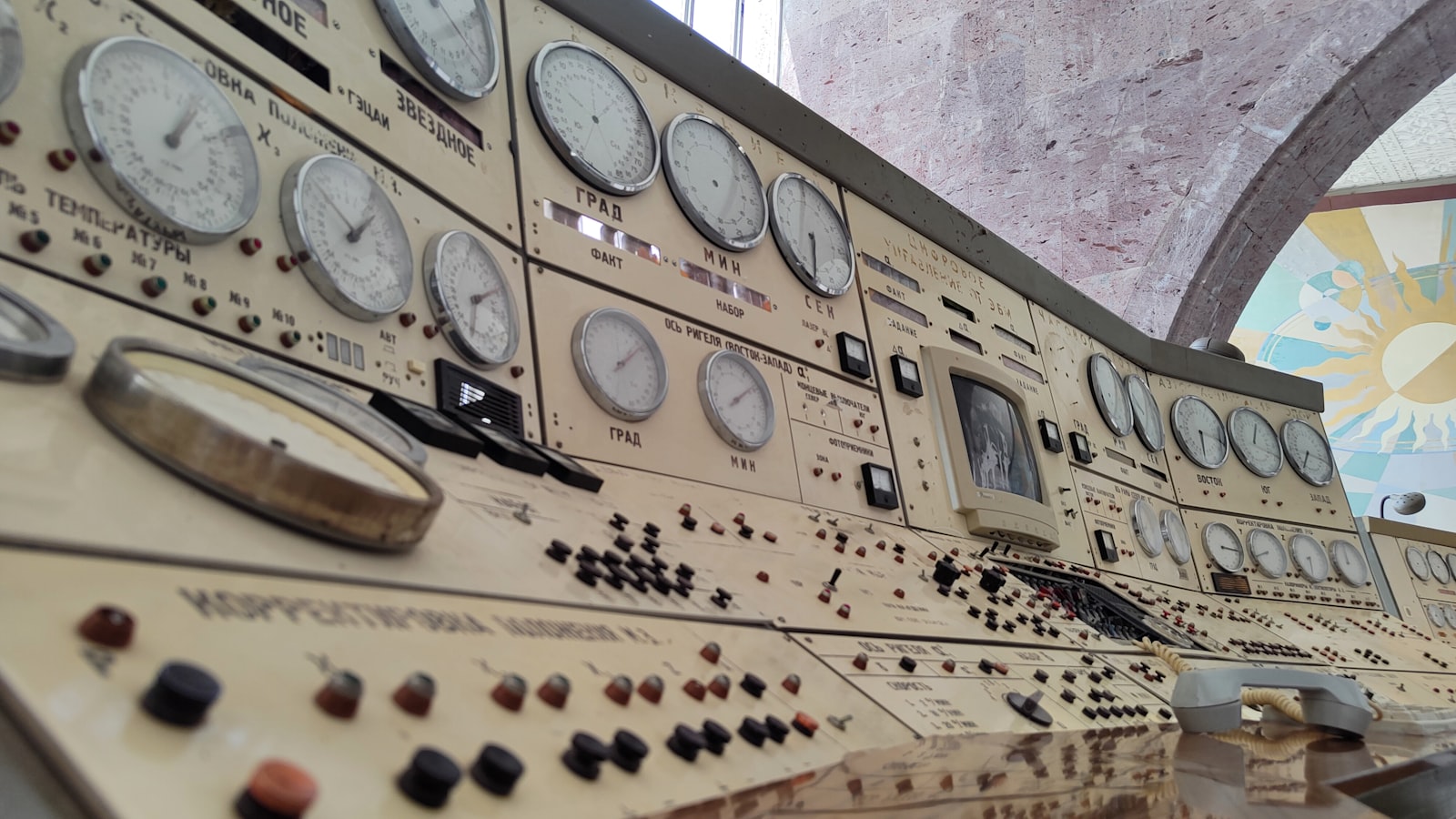 Rows of analog dials and switches on a vintage control panel